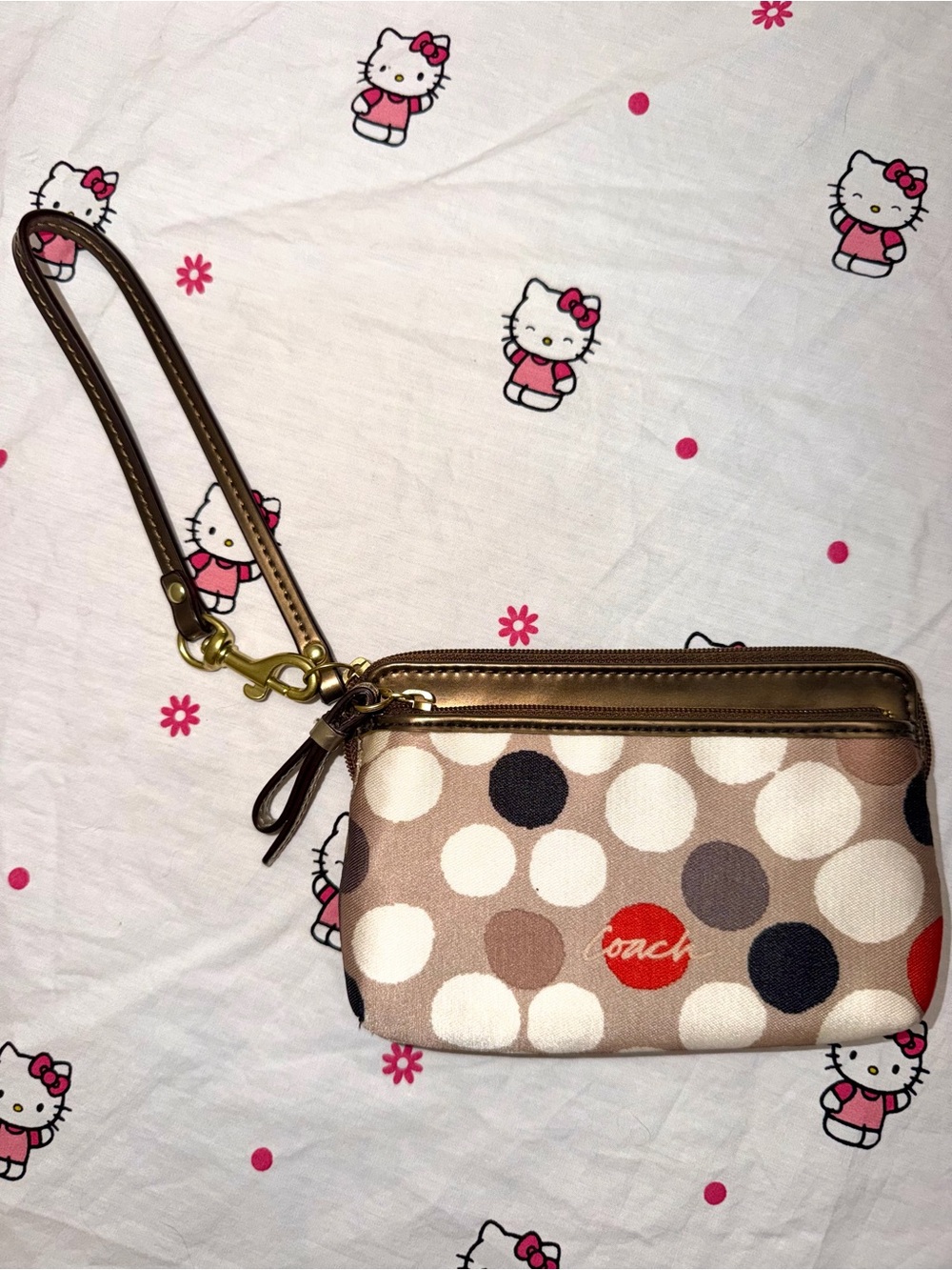 Coach Beige Polka Dot Wristlet with Red Accent